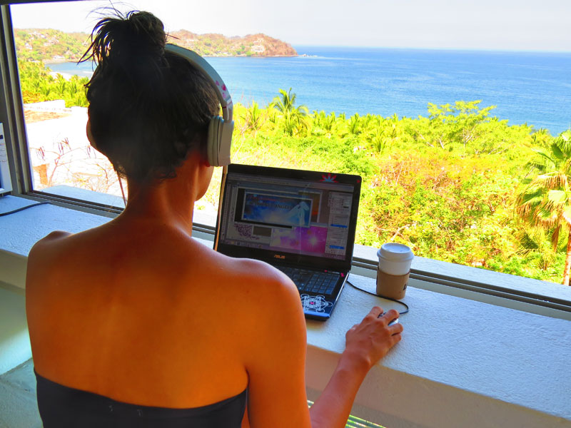 Melanie working on her membership site from our beach house in Mexico